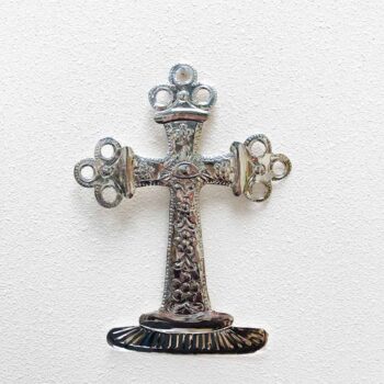 handmade metal cross with eye in the middle